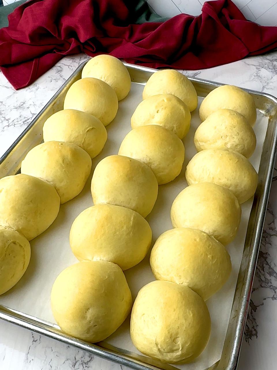 To the rolls are initially parbaked. At this point, the rolls have very little color and are very delicate.