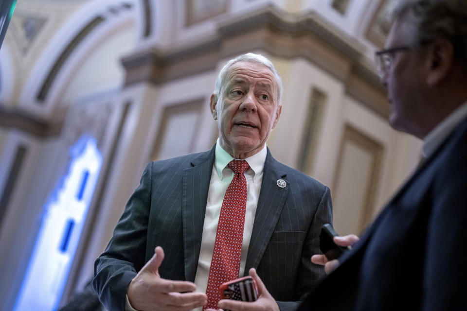 FILE - Rep. Ken Buck, R-Colo., a member of the conservative House Freedom Caucus, stops to speak with a reporter, Dec. 2, 2022, at the Capitol in Washington. (AP Photo/J. Scott Applewhite, File)