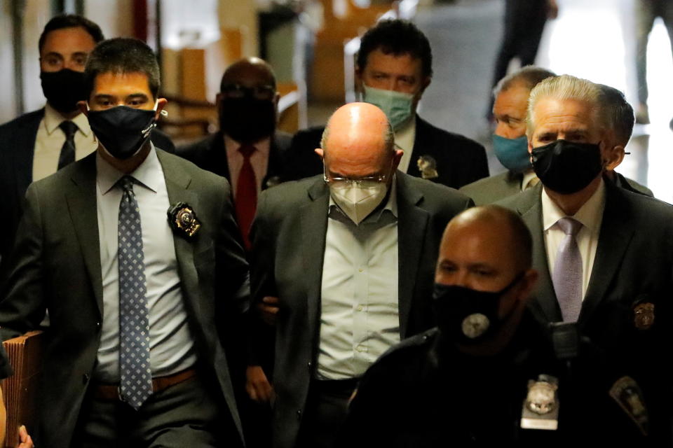 Trump Organization chief financial officer Allen Weisselberg is escorted as he attends his arraignment hearing in the New York State Supreme Court in New York City on July 1, 2021. / Credit: ANDREW KELLY / REUTERS