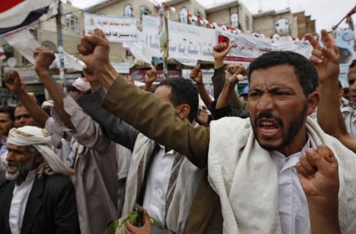 Yemeni anti-government protesters shout slogans during a demonstration calling for the ouster of President Ali Abdullah Saleh in Sanaa on June 1, 2011. Thousands of armed tribesmen were headed towards Sanaa on Thursday to back powerful opposition tribal head Sheikh Sadiq al-Ahmar