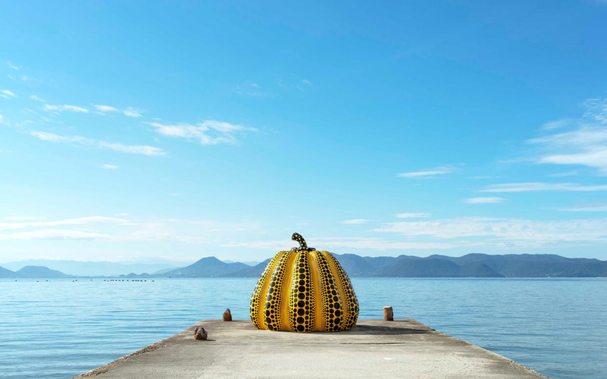 'By the sandy shores, one of Kusama's iconic polka dot pumpkins juts out into the sea – an image now synonymous with the island itself'