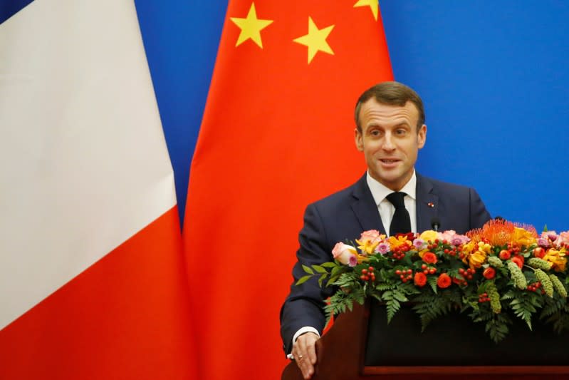 French President Emmanuel Macron speaks at a China-France Economic Forum at the Great Hall of the People in Beijing