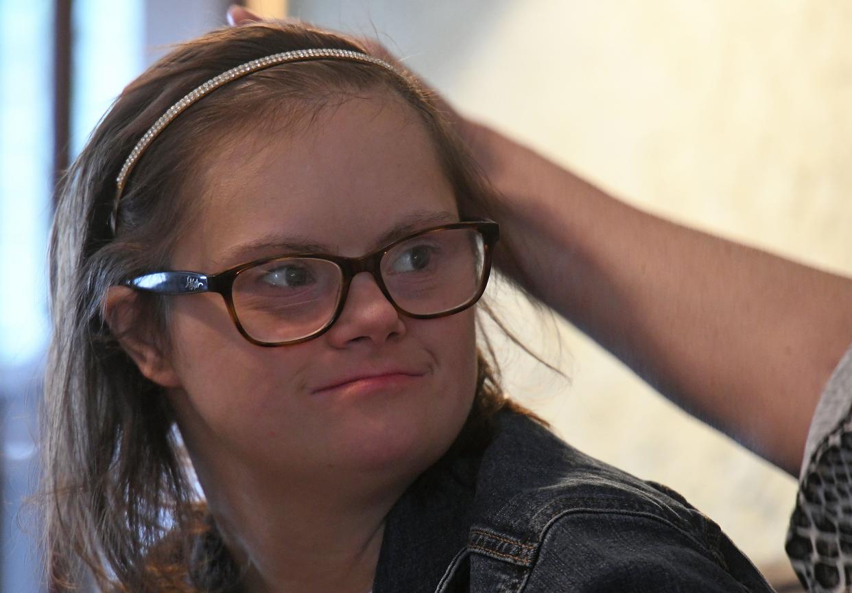 Alana Smale receives encouragement from her mother Mollie during an interview with the News Journal on Wednesday.