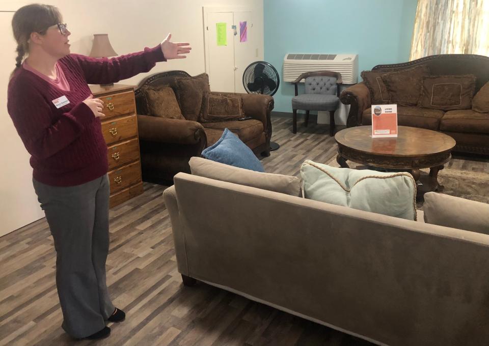 Becca Spielman shows off a room where visitors may relax in the Day Center operated in Topeka by YWCA Northeast Kansas.