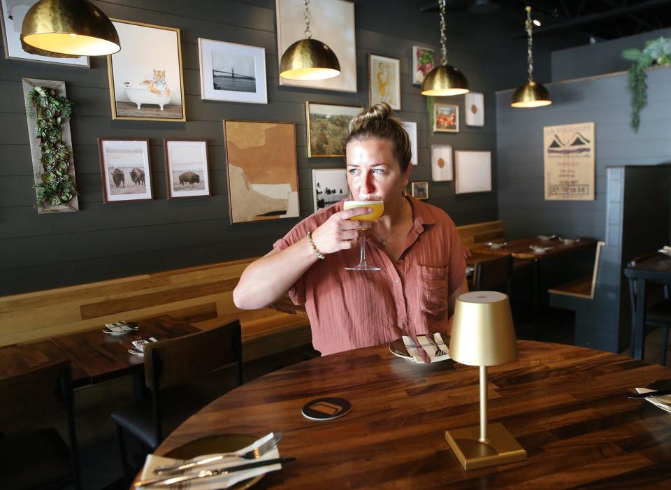 Kiersten Mayes sits in her new restaurant called The Bar Next Door that she and her husband, John Ernst, are opening at York Beach.