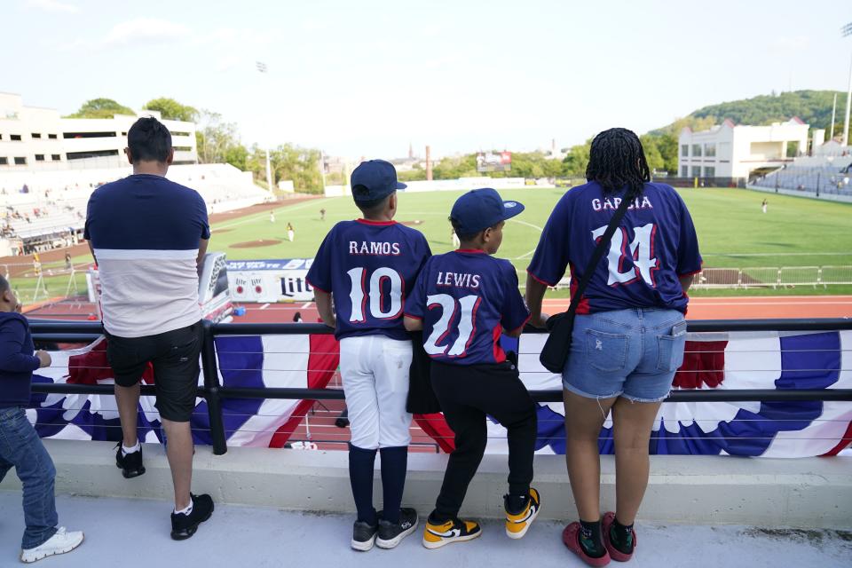 Members of the Silk City Sluggers little league team watch the New Jersey Jackals face the Sussex County Miners in their first game at Hinchliffe Stadium in Paterson on Sunday, May 21, 2023.