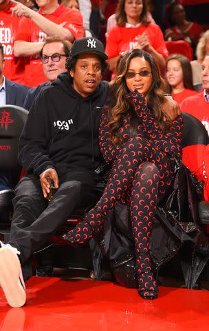 <p>Bill Baptist/NBAE via Getty</p> Jay-Z and By 2019eyonce at a Golden State Warriors vs. Houston Rockets game in Ma