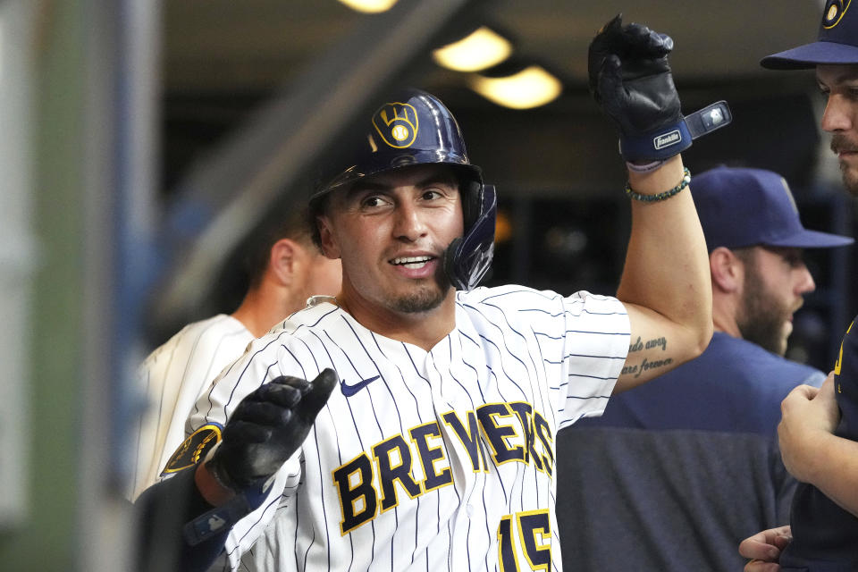 Milwaukee Brewers' Tyrone Taylor (15) is congratulated after scoring against the Philadelphia Phillies during the second inning of a baseball game Saturday, Sept. 2, 2023, in Milwaukee. (AP Photo/Kayla Wolf)