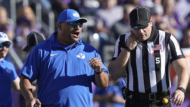 BYU coach Kalani Sitake, left, yells at an official, right, during game against TCU, Saturday, Oct. 14, 2023, in Fort Worth, Texas.