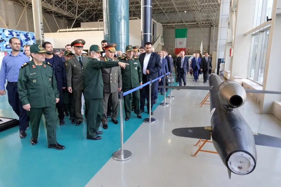 Russian Defense Minister Sergei Shoigu is shown an Iranian land attack cruise missile design during his visit to the IRGC exhibition. <em>Russian Defense Ministry</em>