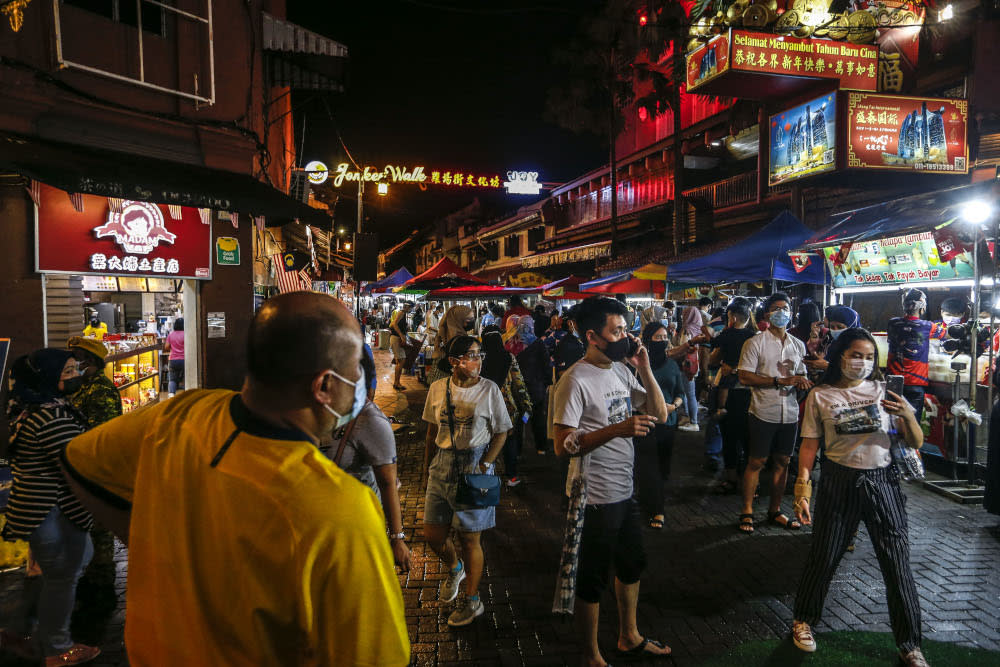 Local tourists are seen at Jonker Street in Melaka December 28, 2020. — Picture by Firdaus Latif