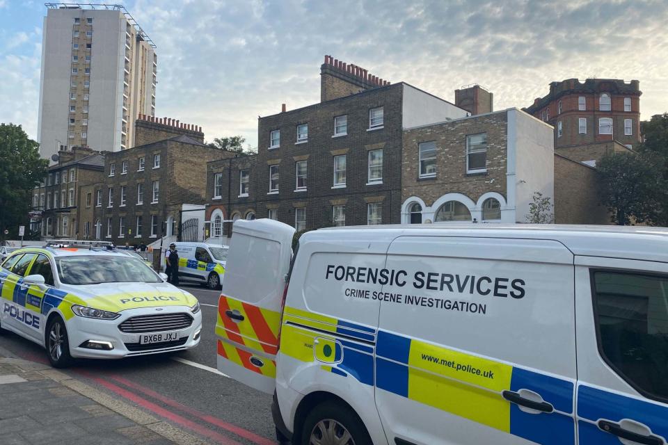 Police at the scene in Stockwell Road, Lambeth (PA)