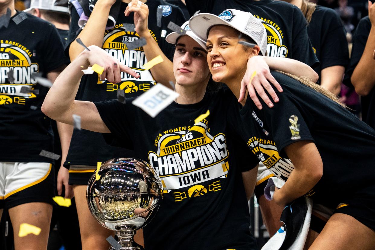 Iowa guards Caitlin Clark (22) and Gabbie Marshall (24) pose for a photo after the Big Ten Tournament championship game at the Target Center on Sunday, March 10, 2024, in Minneapolis, Minn.