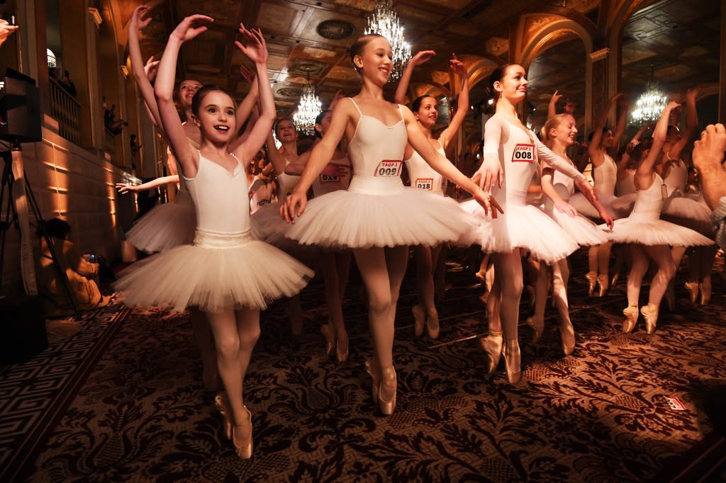Hundreds of young ballet dancers simultaneously perched on their tippy toes — holding the grueling pose for a minute — to set a new world record at the Plaza Hotel in Manhattan Wednesday. Matthew McDermott