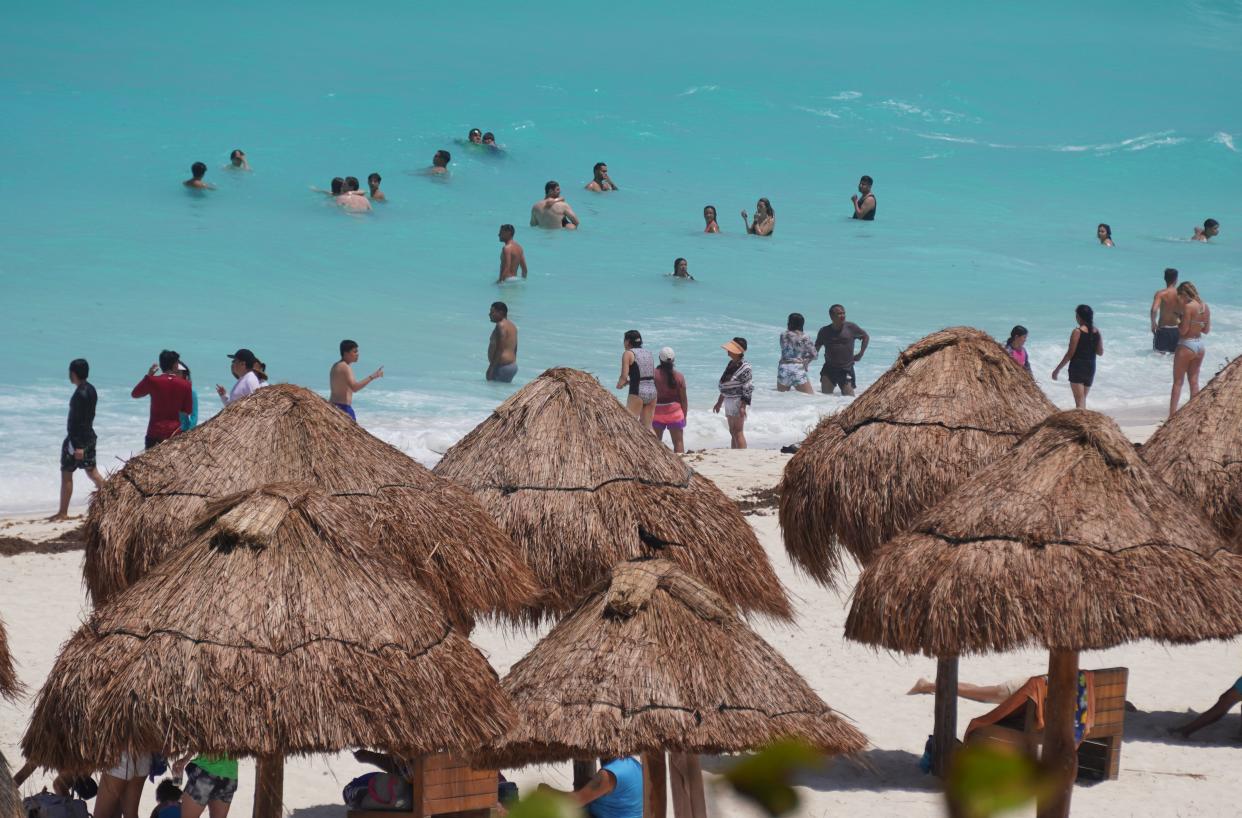 Beachgoers enjoy before the potential arrival of Hurricane Beryl in Cancun, Quintana Roo State, Mexico, on July 3, 2024.