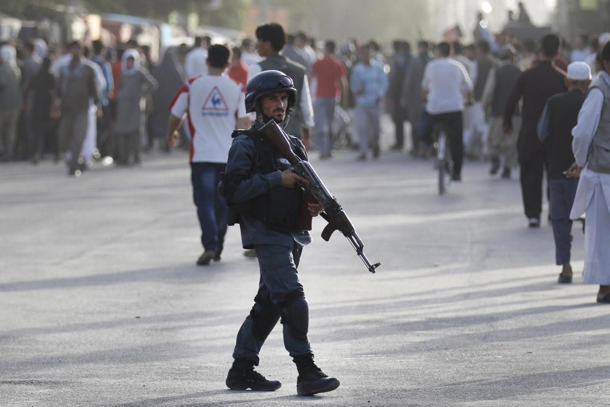 Kabul suicide bombing: Afghan security stand at the scene of the deadly blast: EPA