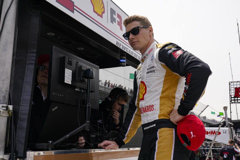 Josef Newgarden waits in the pits area for the start of practice for the Indianapolis 500 auto race at Indianapolis Motor Speedway in Indianapolis, Monday, May 23, 2022. (AP Photo/Michael Conroy)