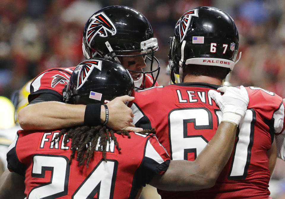 The Atlanta Falcons celebrated a big win Sunday night. (AP) 