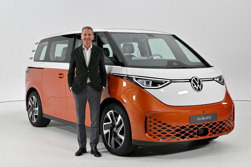 Volkswagen Group Chief Executive Officer (CEO) Herbert Diess poses with the new Volkswagen ID Buzz electric van during its presentation in Hamburg, northern Germany on March 9, 2022. - The German automaker unveiled the camper's latest iteration, known as the ID.Buzz, part of the flagship ID line with which Volkswagen is leading a multi-billion-euro charge into the electric car market. (Photo by John MACDOUGALL / AFP) (Photo by JOHN MACDOUGALL/AFP via Getty Images)