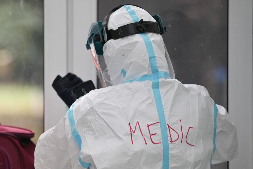 A medic wears a full protective outfit at the COVID-19 unit of the Marius Nasta National Pneumology Institute in Bucharest, Romania, Thursday, Sept. 23, 2021. Romania, which has the second lowest COVID-19 vaccination rate in the European Union, sees an accelerated increase of new infections over the past week, while health authorities currently report 1067 COVID-19 patients in ICU units and only 21 free COVID-19 ICU beds in the entire country, of which 3 in Bucharest. (AP Photo/Vadim Ghirda)