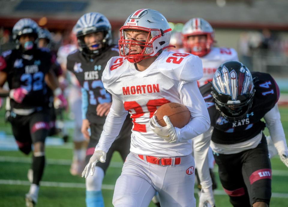 Morton's Seth Glatz (20) slips through the Kankakee defense for a touchdown in the first half  of their Class 5A state football semifinal Saturday, Nov. 20, 2021 in Kankakee. Morton fell to the Kays 41-14.