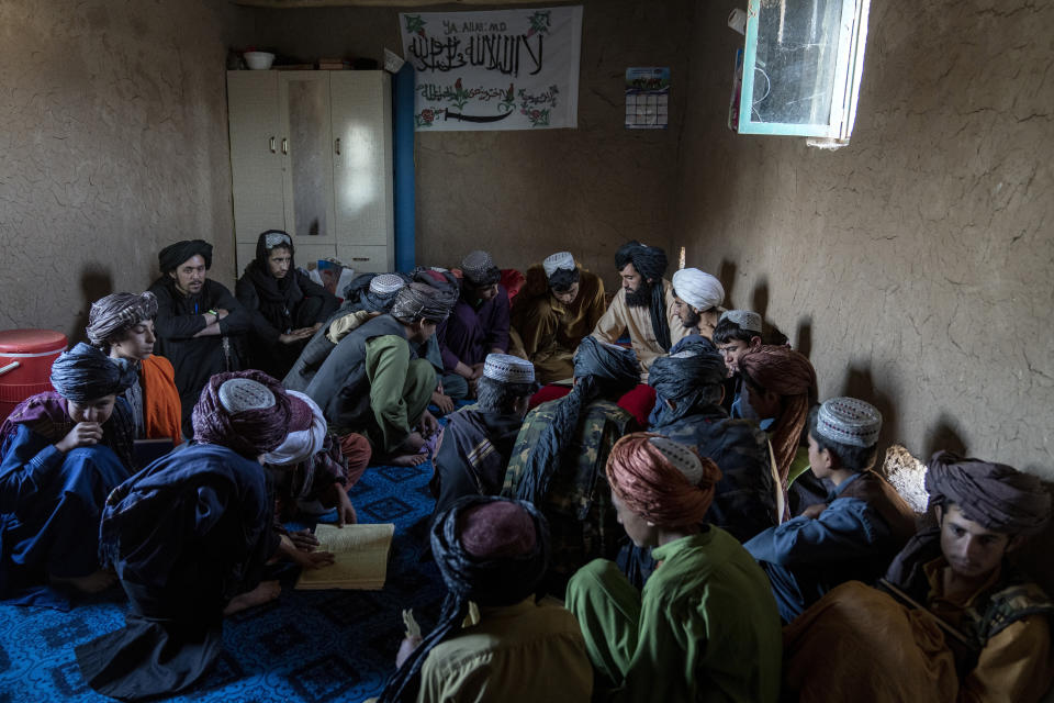 Boys study in a class in a religious school, in a camp for internally displaced people on the outskirts of Herat, Afghanistan, Thursday, June 8, 2023. (AP Photo/Ebrahim Noroozi)