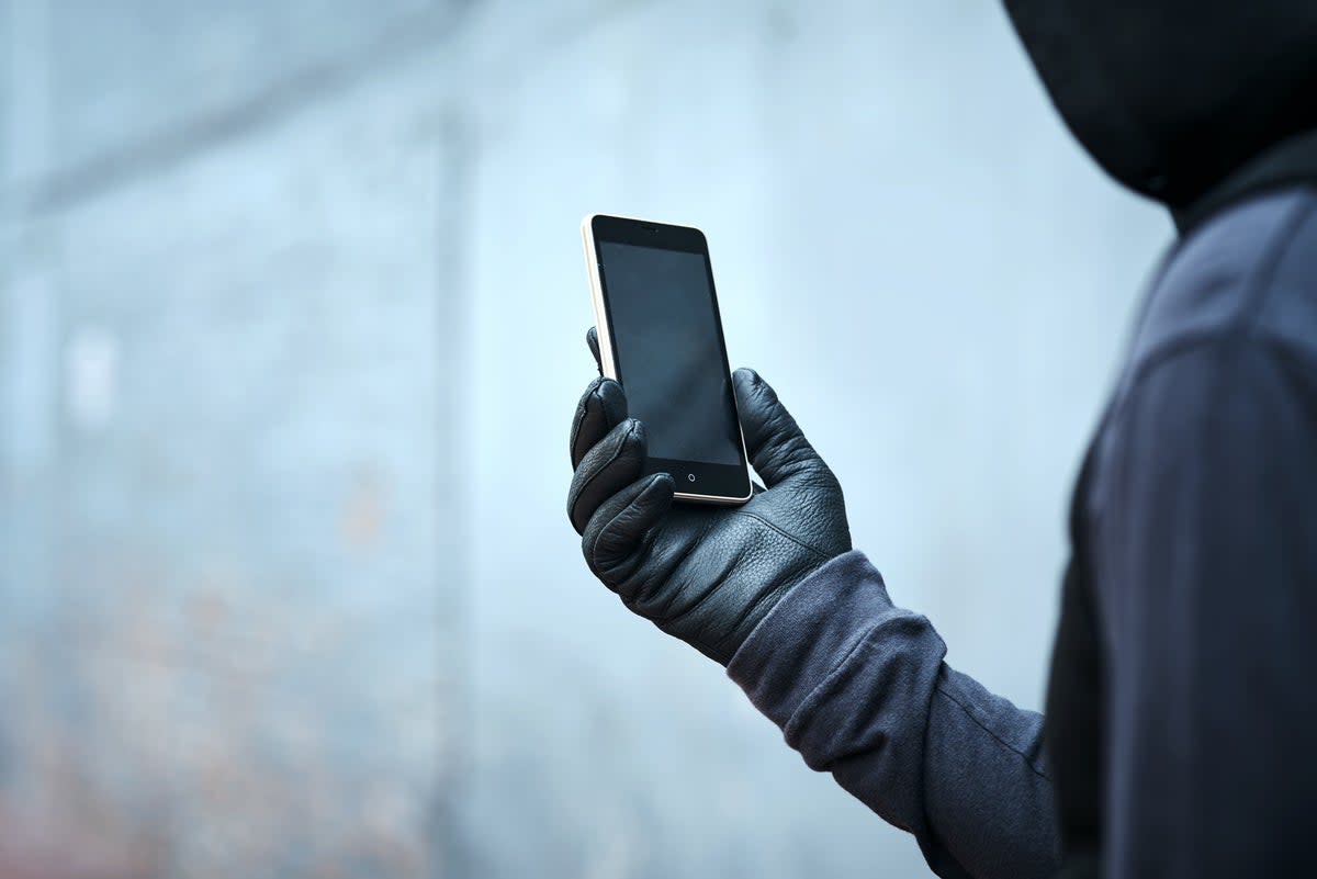 A criminal gang leader has revealed how phone thieves make tens of thousands of pounds a day by “shoulder-surfing” the public to steal their pin number (Getty Images/iStockphoto)