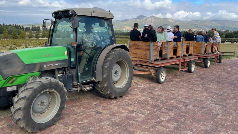 tractor with cart carrying people