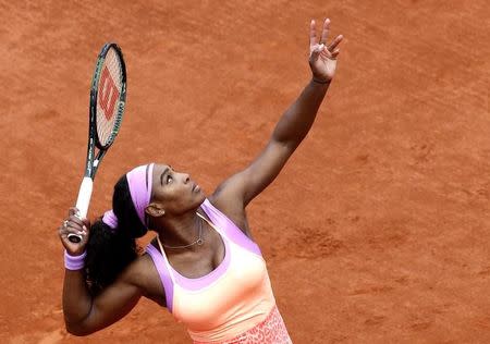 Serena Williams of the U.S. serves to Anna-Lena Friedsam of Germany during their women's singles match at the French Open tennis tournament at the Roland Garros stadium in Paris, France, May 28, 2015. REUTERS/Jean-Paul Pelissier