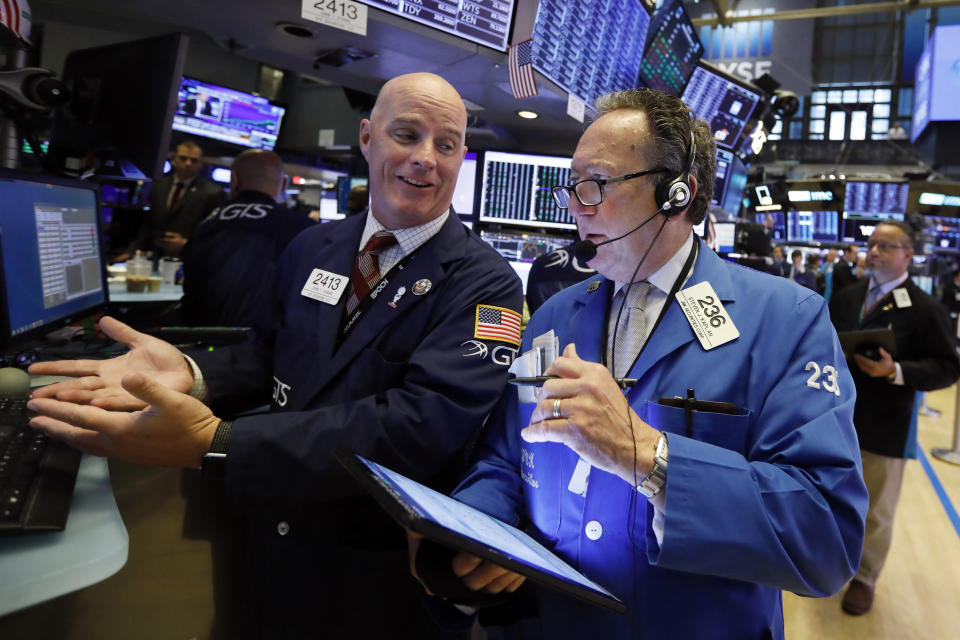 Specialist John O'Hara, left, and trader Steven Kaplan work on the floor of the New York Stock Exchange, Wednesday, Sept. 4, 2019. Stocks are opening higher on Wall Street following big gains in Asia as Hong Kong's government withdrew a controversial extradition law that set off three months of protests there. (AP Photo/Richard Drew)