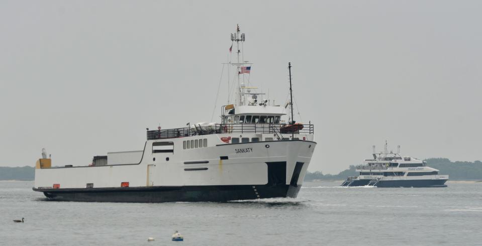 The Steamship Authority's M/V Sankaty, left, comes into the harbor as its sister fast ferry, the M/V Iyanough, heads to Nantucket. Steamship Authority ferries could be seen coming and going off Bay View Beach on Monday. The Authority has announced it is cutting service due to a shortage of workers.