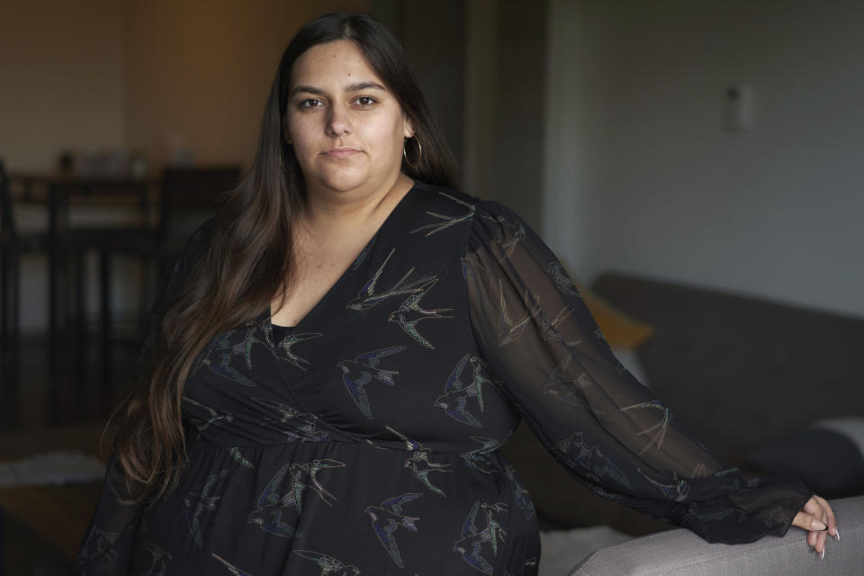 Jaqueline Benitez stands for a portrait at her home in Bellflower, Calif., on Monday, Feb. 13, 2023. Benitez, 21, who works as a preschool teacher, depends on California's SNAP benefits to help pay for food, and starting in March she expects a significant cut, perhaps half, of the $250 in food benefits she has received since 2020. (AP Photo/Allison Dinner)