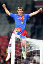 <p>Branislav Ivanovic of Chelsea sits on the goal cross bar as he celebrates victory.</p>