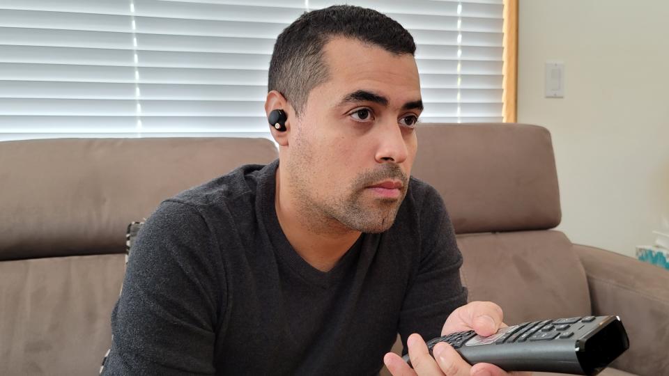 Our reviewer testing noise cancellation on the Sony WF-1000XM4