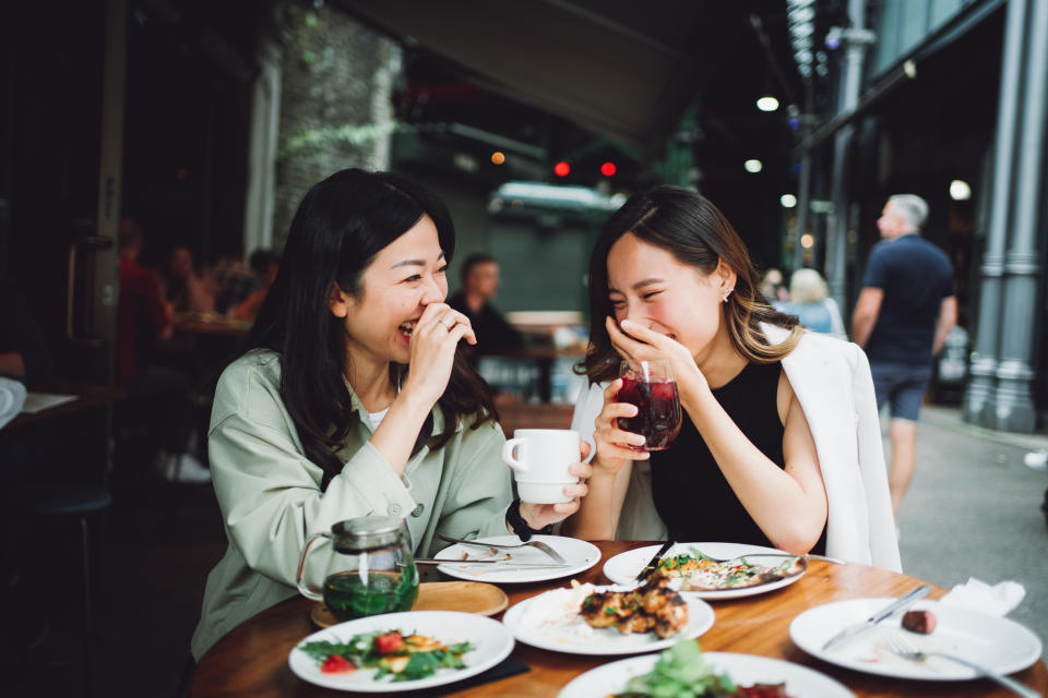 Asian women happy chatting over lunch gathering