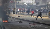 Supporters and opponents of ousted Egyptian President Mohamed Mursi clash at Nasr City district in Cairo, January 3, 2014. (REUTERS/ Mohamed Abd El Ghany)