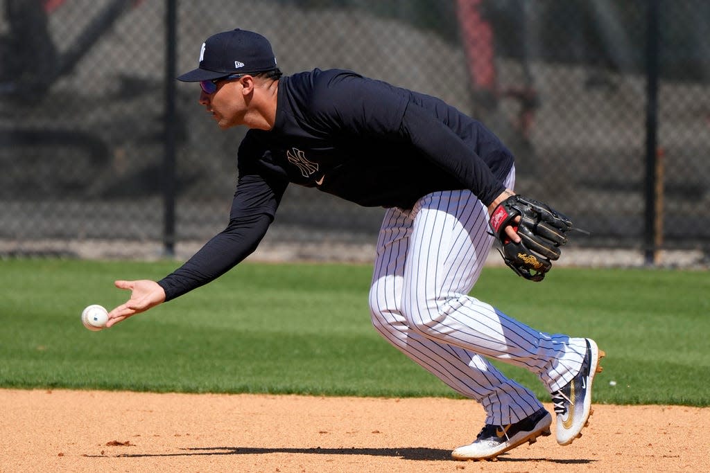 New York Yankees second baseman Gleyber Torres fields a ground ball during a baseball spring training workout Wednesday, Feb. 21, 2024, in Tampa, Fla. (AP Photo/Charlie Neibergall)