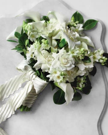 <div class="caption-credit"> Photo by: Johnny Miller</div><b>Classic Wedding Bouquet <br></b> <br> Green leaves add depth to gardenias, camellias, and calla lilies, while a pleated satin handle wrap provides texture. <br> <br> <b>Plus:</b> <a href="http://www.marthastewartweddings.com/269158/classic-wedding-bouquets/@center/272502/bouquets?xsc=synd_yshine" rel="nofollow noopener" target="_blank" data-ylk="slk:See More Classic Wedding Bouquets;elm:context_link;itc:0;sec:content-canvas" class="link ">See More Classic Wedding Bouquets</a>