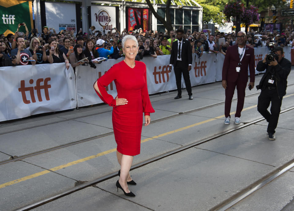 Actress Jamie Lee Curtis walks the street for photographs on the red carpet for the new movie "Knives Out" at the Toronto International Film Festival in Toronto, on Saturday, Sept. 7, 2019. (Nathan Denette/The Canadian Press via AP)