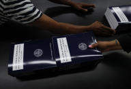 <p>GPO workers stack and prepare copies of “Analytical Perspectives Budget of the U.S. Government Fiscal Year 2018”, May 19, 2017, at the U.S. Government Publishing Office’s (GPO) plant Washington. (Photo: Carolyn Kaster/AP) </p>