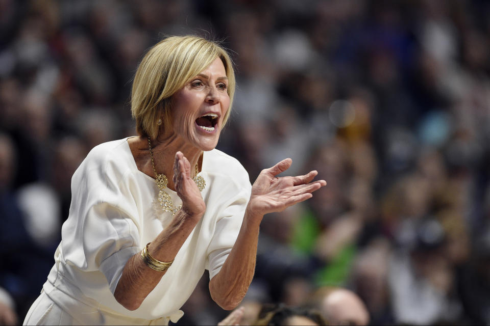 Connecticut associate head coach Chris Dailey calls to her team in the first half of an NCAA college basketball game against Oklahoma, Sunday, Dec. 22, 2019, in Uncasville, Conn. (AP Photo/Jessica Hill)