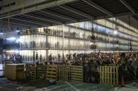 Protesters use makeshift barricades during a demonstration at El Prat airport, outskirts of Barcelona, Spain, Monday, Oct. 14, 2019. Spain's Supreme Court on Monday sentenced 12 prominent former Catalan politicians and activists to lengthly prison terms for their roles in a 2017 bid to gain Catalonia's independence, sparking protests across the wealthy Spanish region. (AP Photo/Bernat Armangue)