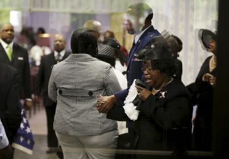 Judy Scott weeps as she is escorted in for the funeral of her son, Walter Scott, at W.O.R.D. Ministries Christian Center, Saturday, April 11, 2015, in Summerville. REUTERS/David Goldman/Pool