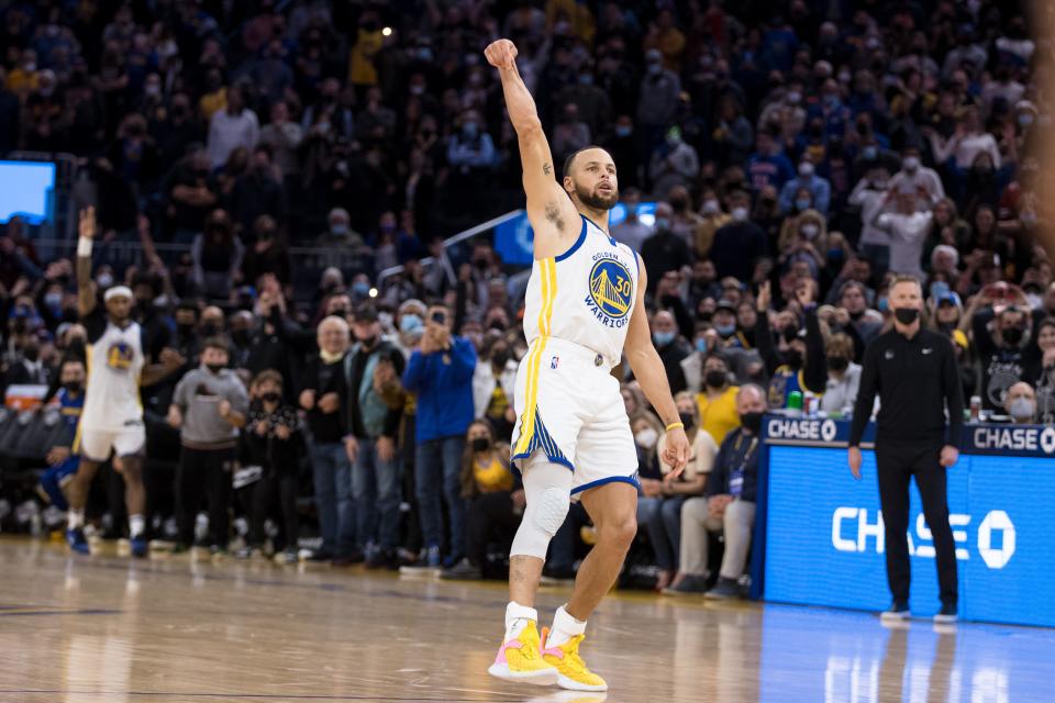 Golden State Warriors guard Stephen Curry celebrates his game-winning buzzer-beater against the Houston Rockets.