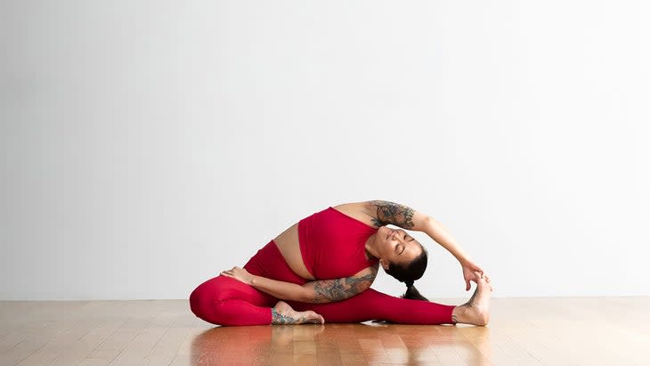 Woman in Revolved Head-to-Knee Pose