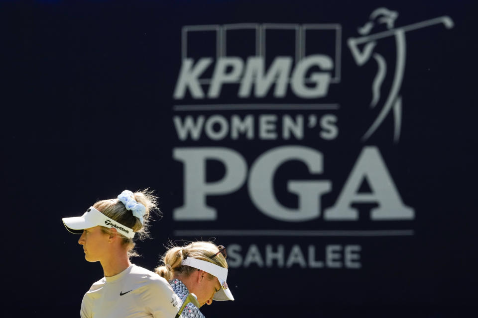 Nelly Korda, left, walks past Sophia Popov, of Germany, as they work on the 18th hole during a practice round for the Womens PGA Championship golf tournament at Sahalee Country Club, Wednesday, June 19, 2024, in Sammamish, Wash. (AP Photo/Lindsey Wasson)