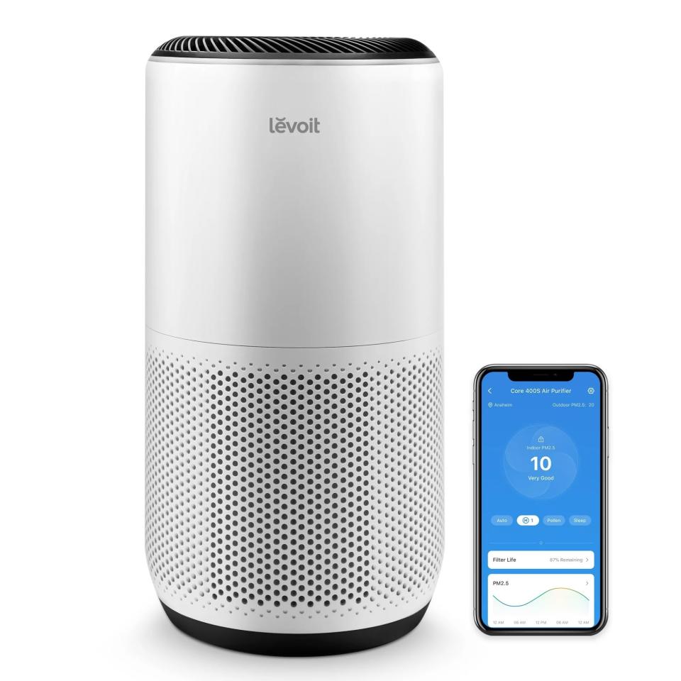 the air purifier next to a phone app