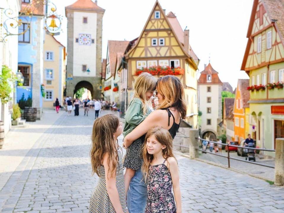 Diana Blinkhorn hugging and holding daughters