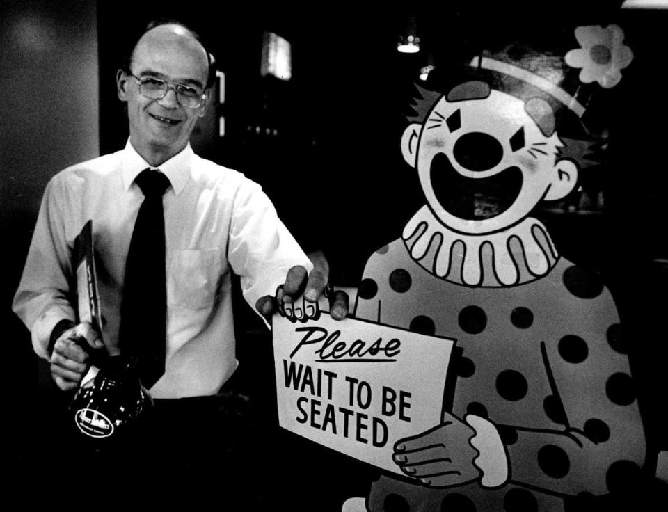 Mike Ognisty, then the manager of Pancake Circus, stands with the cut-out clown that greeted customers at the restaurant in 1985.