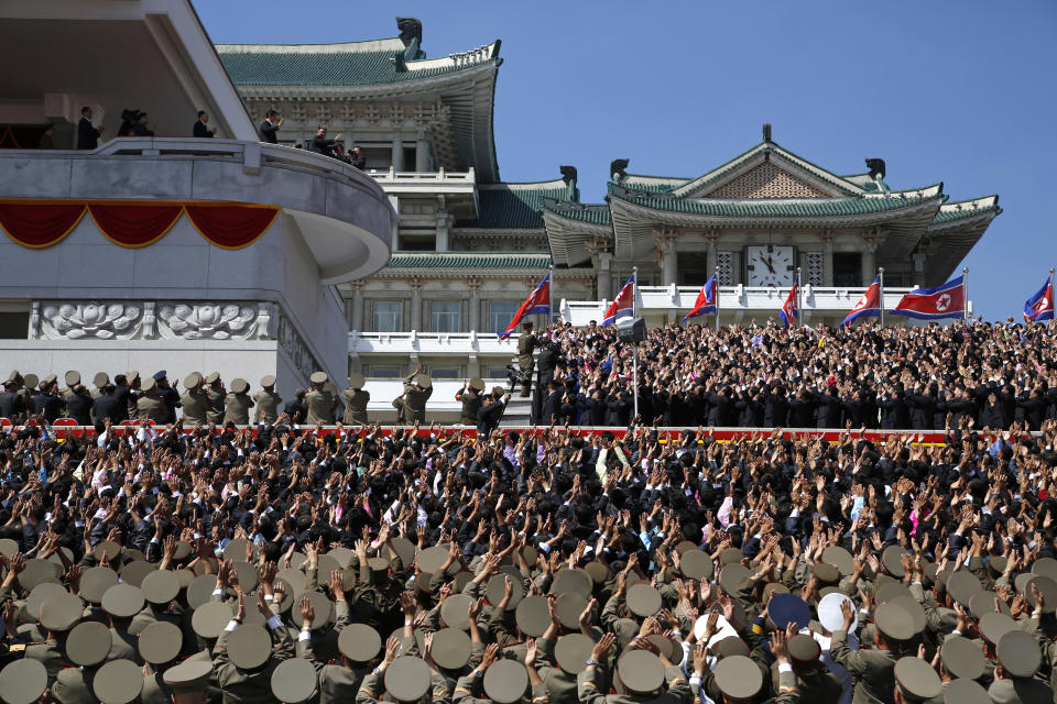 North Korean leader Kim Jong Un, center top left, waves as he leaves after a parade for the 70th anniversary of North Korea's founding day in Pyongyang, North Korea, Sunday, Sept. 9, 2018. North Korea staged a major military parade, huge rallies and will revive its iconic mass games on Sunday to mark its 70th anniversary as a nation. (AP Photo/Ng Han Guan)